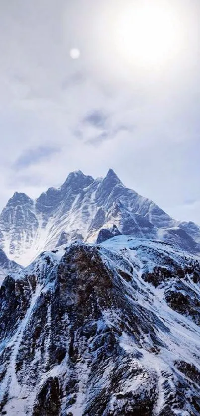 Majestic snowy mountain under a clear blue sky.