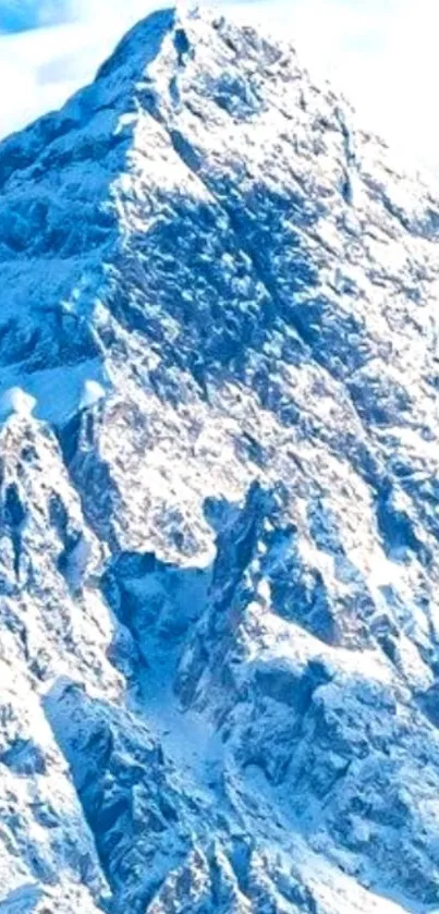 Snowy mountain peak under blue sky