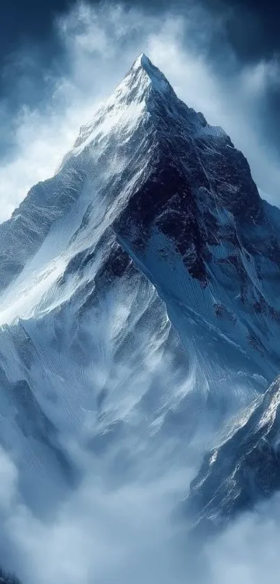 Majestic snowy mountain peak under blue sky.