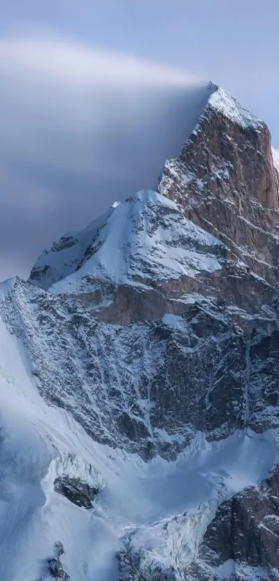 Majestic snowy mountain peak with clear blue sky.