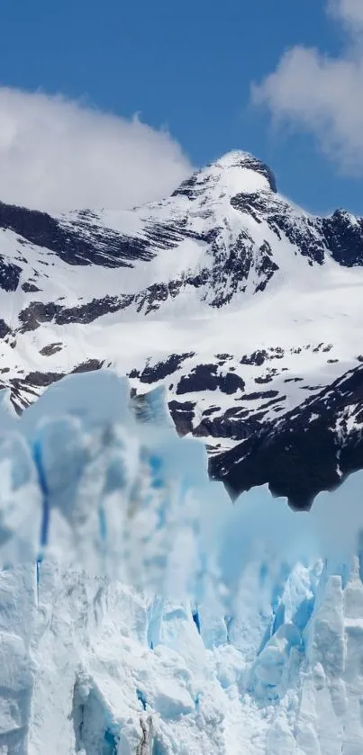 Snowy mountain peaks with glaciers under a clear blue sky.