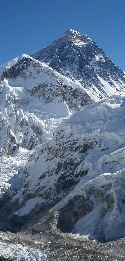 Stunning view of snow-covered mountain peaks under a clear blue sky.