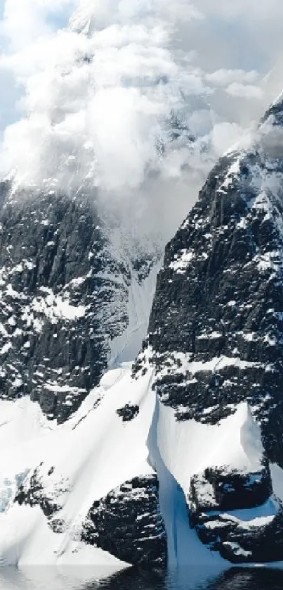 Majestic snowy mountains reflecting on a tranquil lake.