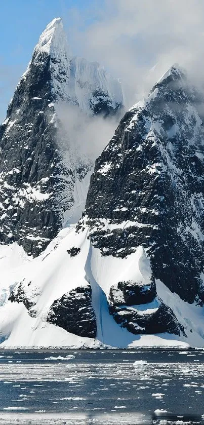 Snowy mountain peaks with blue skies and a frozen landscape.