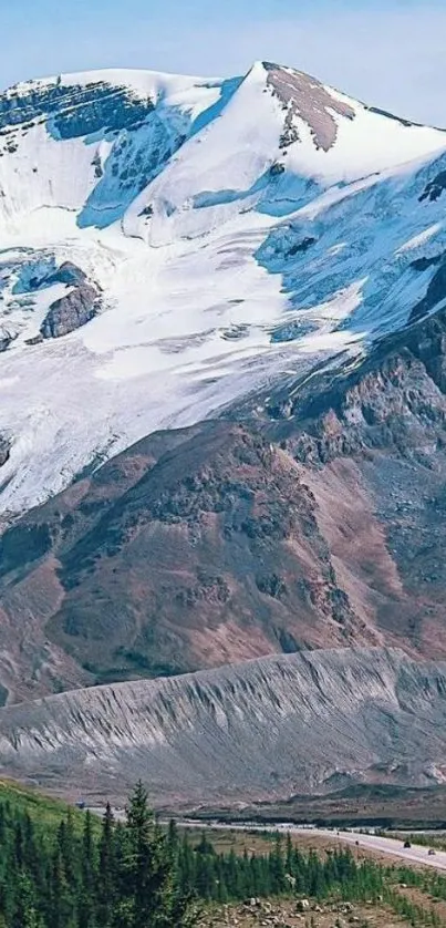 Snowy mountain peaks with lush valley.