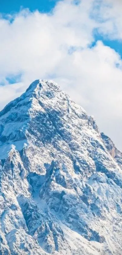 Majestic snowy mountain under a vibrant blue sky.