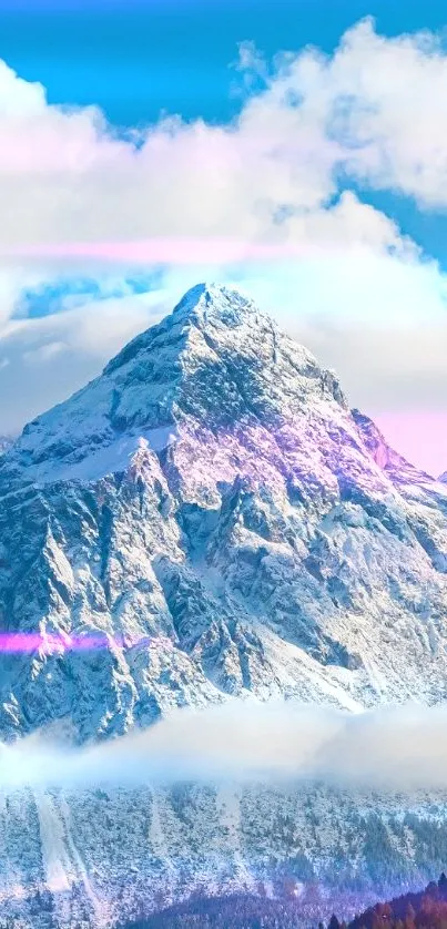 Snowy mountains under blue sky at sunrise.