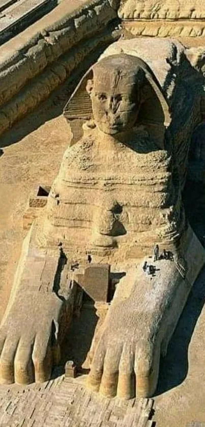 Aerial view of the Great Sphinx of Giza in golden sandstone hues.