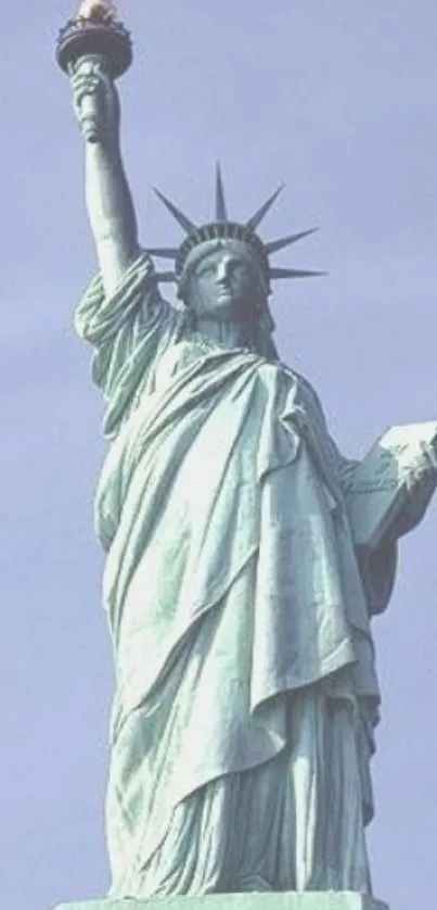 Statue of Liberty with pale cyan sky background.