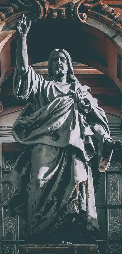 Majestic statue in ancient architectural facade on mobile wallpaper.