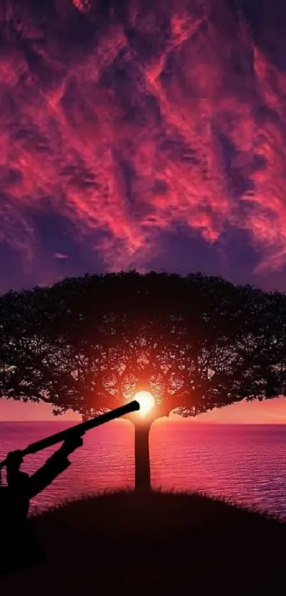 Silhouette of a tree against a vibrant purple sunset sky.