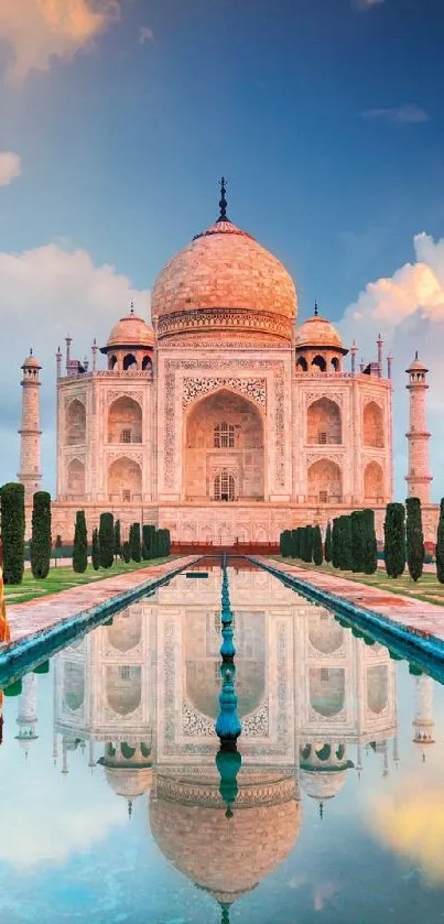 Taj Mahal reflection in calm water with a vibrant sky backdrop.