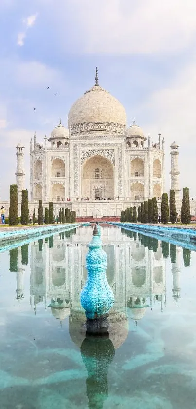 Reflection of Taj Mahal in water under a blue sky.