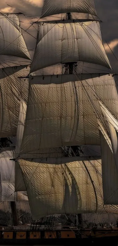 Majestic tall ship with full sails against a dramatic sky, perfect for mobile wallpaper.