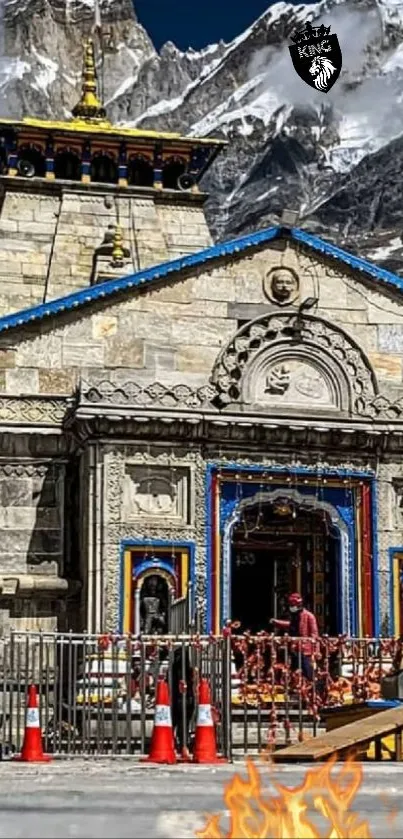 Ancient stone temple with mountain backdrop.