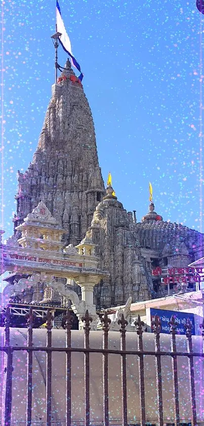 Majestic stone temple against clear blue sky.