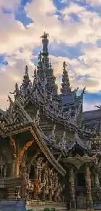 Intricate wooden temple under blue sky with sunset.