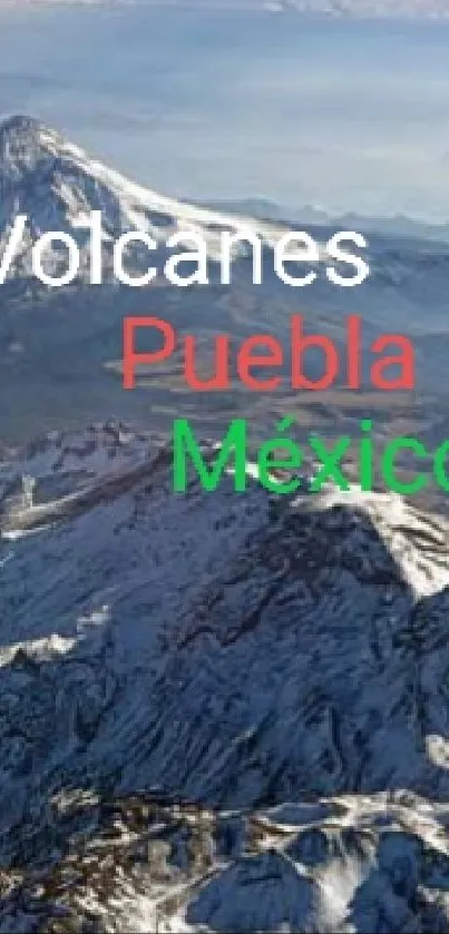 Snow-capped Mexican volcanic peaks in Puebla landscape.