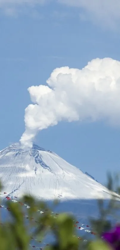Volcano with smoke and purple flowers under a blue sky.