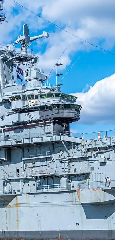 Majestic warship against a clear blue sky.