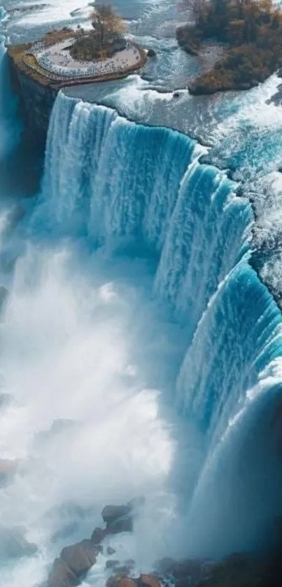 A stunning aerial view of a majestic waterfall with powerful water flow.