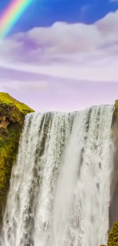 Waterfall cascading with a rainbow in the sky.