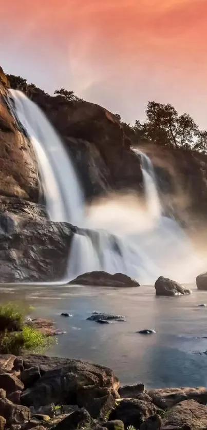 Stunning waterfall illuminated by a warm sunset sky.