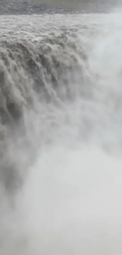 Majestic waterfall cascading with misty flow.