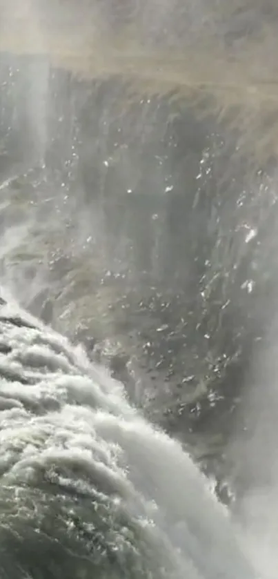 Waterfall cascading over cliffs in nature scene.