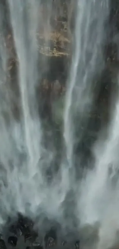 Majestic waterfall splashing down rocky cliffs.