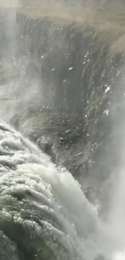 Dynamic waterfall scene with powerful water flow over rugged cliff.