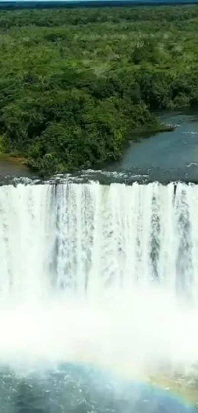 Majestic waterfall cascading with lush green forest backdrop.