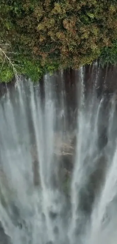 Majestic waterfall cascading down lush green cliffs.