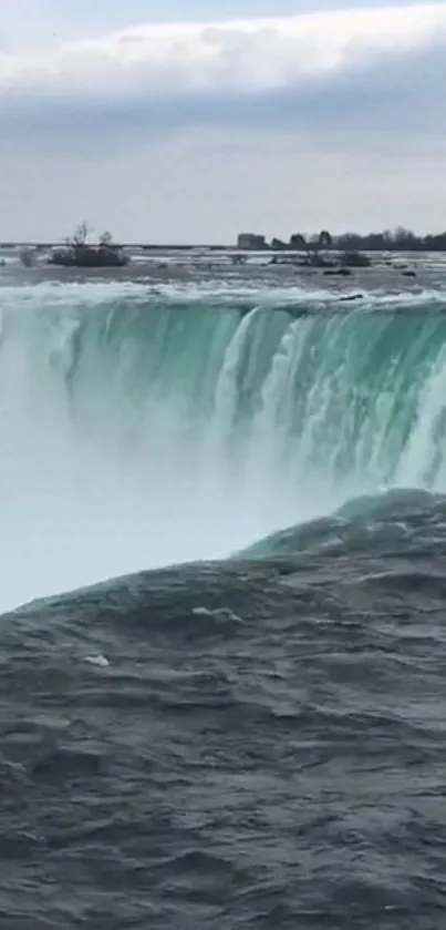 Stunning view of a majestic waterfall with cascading water and scenic surroundings.