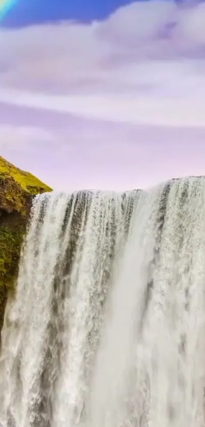 Majestic waterfall with rainbow in nature.