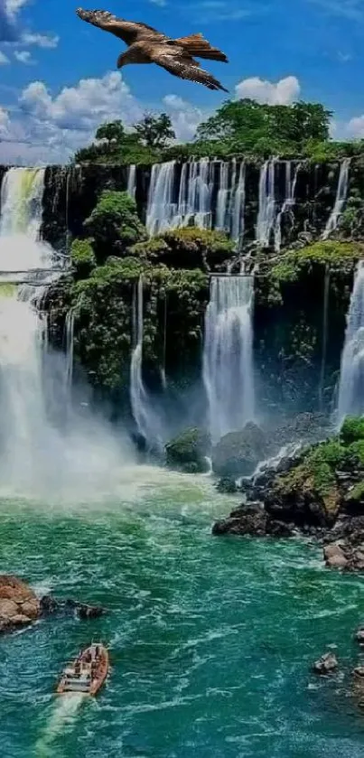 Majestic waterfall with a blue sky and flying eagle in nature wallpaper.