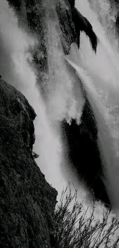 Black and white waterfall cascading over rugged cliffs.