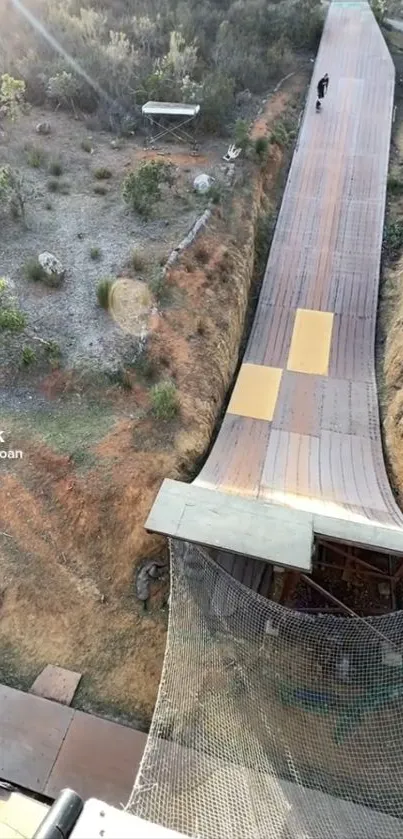 High-angle view of a wooden skate ramp in an outdoor setting.