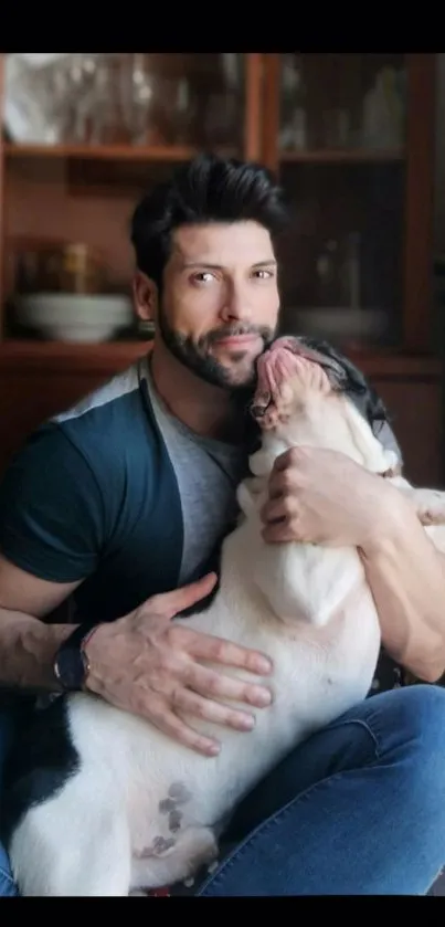 Man hugging a joyful bulldog in a cozy home setting.