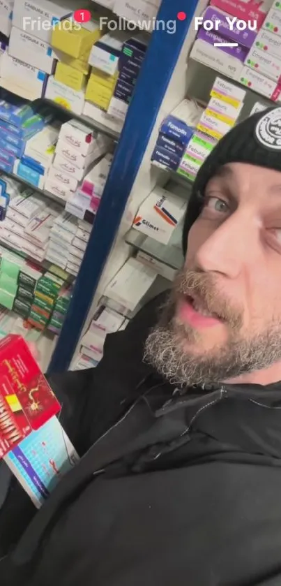 Person exploring pharmacy aisle filled with colorful medicine boxes.