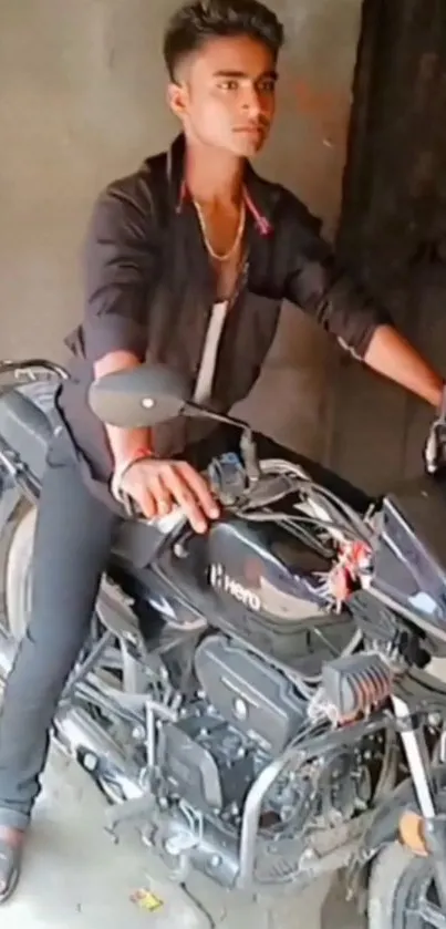 Stylish man posing on a Hero motorcycle in an urban setting.