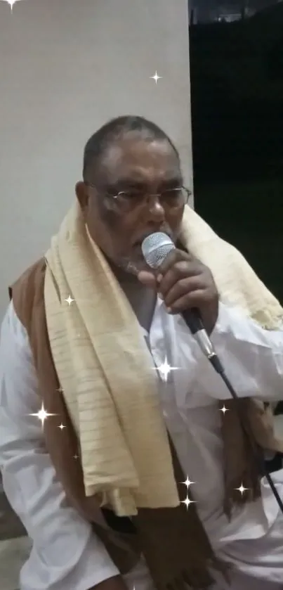 Man singing with microphone amid sparkles in a serene night setting.