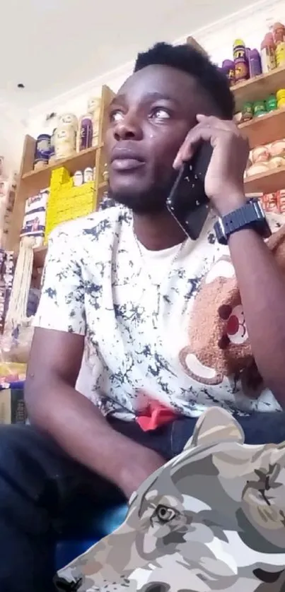 Man speaking on phone in a store.