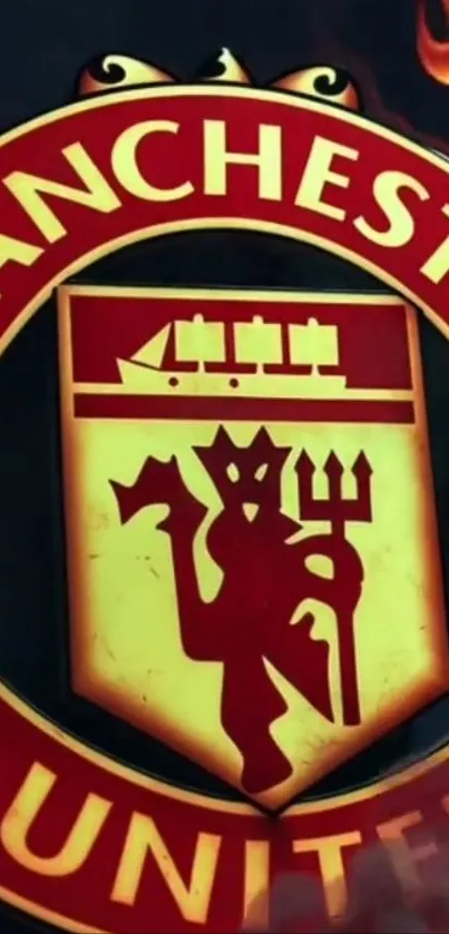 Manchester United emblem on fiery background.