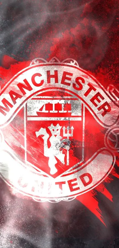 Manchester United emblem on red and black mobile wallpaper.