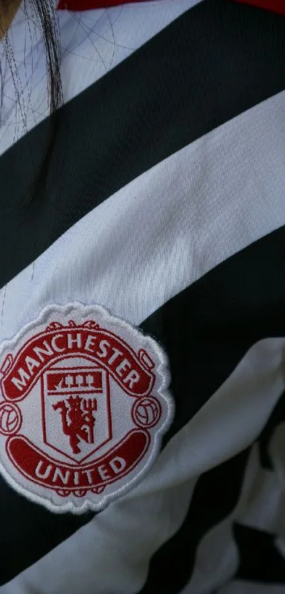 Manchester United black and white jersey with team crest.