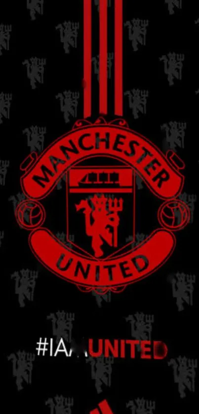 Manchester United logo on a dark background wallpaper.