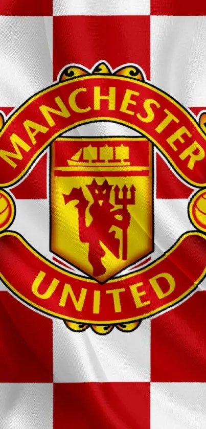 Manchester United red and yellow crest on checkered design.