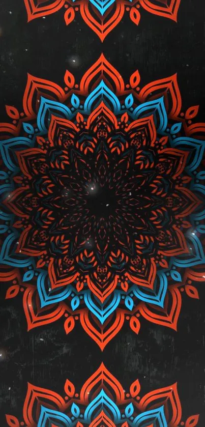 Red and blue mandala pattern on black background.