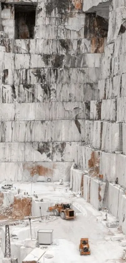 A stunning marble quarry with large stone walls and machinery.